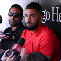Suspended Padres shortstop Fernando Tatis Jr. (center) addresses the media before the team's game against the Guardians in San Diego on Tuesday. | USA TODAY / VIA REUTERS