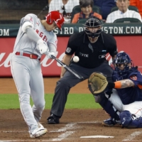 The Angels' Shohei Ohtani homers against the Astros during the third inning of their game in Houston on Sunday. | KYODO