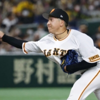 Giants closer Taisei Ota pitches against the Tigers at Tokyo Dome on Saturday. | KYODO