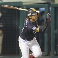 Kenta Imamiya of the SoftBank Hawks hits an RBI single in the fifth inning of a baseball game against the Rakuten Eagles on in Sendai on Thursday. | KYODO