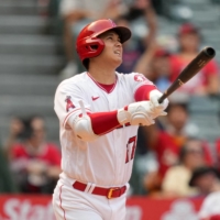 Shohei Ohtani hits a home run against the Tigers in Anaheim on Wednesday. | USA TODAY / VIA REUTERS