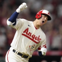 Shohei Ohtani celebrates as he rounds the bases after hitting a go-ahead, three-run home run in the sixth inning of the Angels' 3-2 win over the Yankees in Anaheim, California, on Wednesday. | AP / VIA KYODO