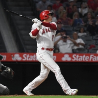 Shohei Ohtani hits a single against the Athletics in Anaheim, California, on Tuesday. | USA TODAY / VIA REUTERS