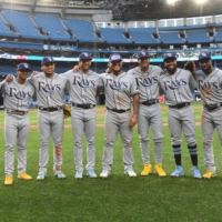 Tampa Bay Rays players of Latin American descent pose for a group photo after defeating the Toronto Blue Jays 11-0 at Rogers Center, in Toronto, on Thursday. The Rays fielded the first ever starting lineup of Latin American descent in MLB history. (From left) Rene Pinto, Yandy Diaz, Wander Franco, second baseman Isaac Paredes (17), left fielder David Peralta (6), first baseman Harold Ramirez (43), center fielder Jose Siri (22), designated hitter Manuel Margot (13) and right fielder Randy Arozarena (56). | USA TODAY / VIA REUTERS