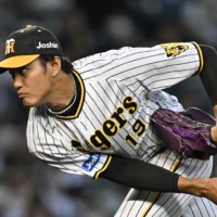 Tigers starter Shintaro Fujinami pitches against the Giants in Nishinomiya, Hyogo Prefecture, on Sept. 3. | KYODO