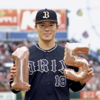 Orix pitcher Yoshinobu Yamamoto celebrates his 15th win of the season after beating the Eagles in Sendai on Saturday. | KYODO