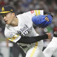 Hawks starter Yugo Bando pitches against the Lions in Fukuoka on Saturday. | KYODO
