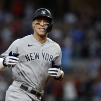 Yankees right fielder Aaron Judge rounds the bases after hitting his 62nd home run of the season against the Rangers in Arlington, Texas, on Tuesday. | USA TODAY / VIA REUTERS
