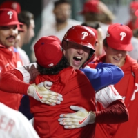 Phillies first baseman Rhys Hoskins (17) celebrates his two-run home run in the fifth against the Padres during Game 4 of the National League Championship Series in Philadelphia on Saturday. | USA TODAY / VIA REUTERS