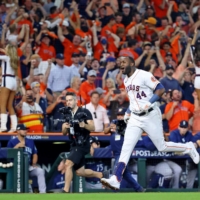 Astros designated hitter Yordan Alvarez celebrates after hitting a walk-off home run against the Mariners in Game 1 of their AL division series in Houston on Tuesday. | USA TODAY / VIA REUTERS