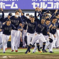 The Buffaloes celebrate after clinching the Pacific League pennant in Sendai on Sunday. | KYODO