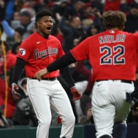 Cleveland Guardians right fielder Oscar Gonzalez (left) reacts after hitting the game winning single against the New York Yankees in Game 3 of the 2022 ALDS at Progressive Field, in Cleveland, Ohio, on Saturday. | USA TODAY / VIA REUTERS