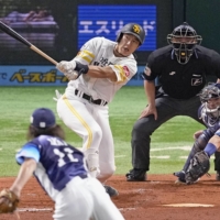 The Hawks' Yuki Yanagita hits a grand slam against Lions pitcher Tatsuya Imai during Game 2 of the Pacific League Climax Series First Stage in Fukuoka on Sunday. | KYODO