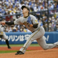 Tigers starter Koyo Aoyagi pitches against the BayStars in Yokohama on Saturday. | KYODO