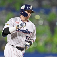 The Swallows Munetaka Murakami rounds the bases after hitting two-run home run in Game 2 of the Climax series against the Hanshin Tigers, at Jingu Stadium on Thursday. | KYODO