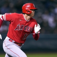 Shohei Ohtani runs to first base after hitting a double against the Athletics in Oakland, California, on Monday. | USA TODAY / VIA REUTERS