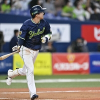 The Swallows' Tetsuto Yamada hits a three-run home run against the Buffaloes during Game 3 of the Japan Series at Kyocera Dome Osaka on Tuesday. | KYODO