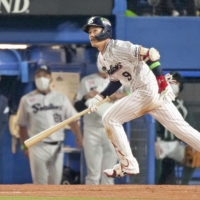 The Swallows' Yasutaka Shiomi leads off the third inning with a solo home run against the Buffaloes during Game 1 of the Japan Series at Jingu Stadium on Saturday. | KYODO