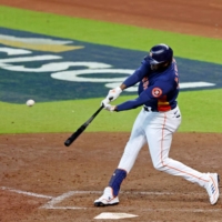 Houston Astros left fielder Yordan Alvarez (center) hits a two-run home run against the Seattle Mariners during the sixth inning of Game 2 of the ALDS in the 2022 MLB Playoffs at Minute Maid Park, in Houston, on Thursday. | USA TODAY / VIA REUTERS