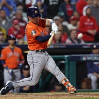 Astros third baseman Alex Bregman doubles against the Phillies during Game 5 of the World Series in Philadelphia on Thursday. The Astros lead the series 3-2. | USA TODAY / VIA REUTERS
