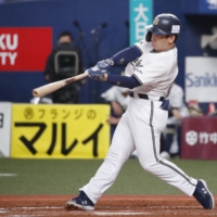 Masataka Yoshida batted .335 and hit 21 home runs in 119 games in 2022. | KYODO