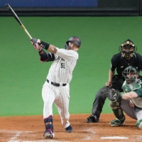 Japan's Munetaka Murakami hits a two-run home run against Australia during the fifth inning at Sapporo Dome on Wednesday. Japan won 8-1. | KYODO