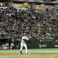 Munetaka Murakami hits a sixth-inning home run for Samurai Japan against the Fighters at Tokyo Dome on Saturday. | KYODO