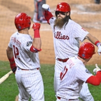 Phillies center fielder Brandon Marsh (center) celebrates his home run against the Astros during Game 3 of the World Series in Philadelphia on Tuesday. | USA TODAY / VIA REUTERS
