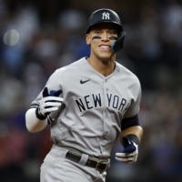 The Yankees' Aaron Judge rounds the bases after hitting his 62nd home run to establish a new AL single-season record in Arlington, Texas, on Oct. 4. | USA TODAY / VIA REUTERS