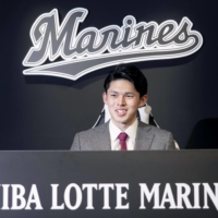 Roki Sasaki participates in a news conference following negotiations for his 2023 contract in Chiba on Saturday. | KYODO