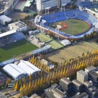 Jingu Stadium (upper right) and the Prince Chichibu Memorial Rugby Ground (upper left) near a grove of ginkgo trees on Dec. 3 | KYODO