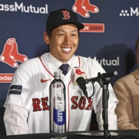 Masataka Yoshida speaks during his introductory news conference with the Red Sox in Boston on Jan. Dec. 15, 2022. | KYODO