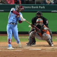 The Phillies' Bryce Harper doubles against the Astros during the fifth inning in Game 5 of the World Series in Philadelphia on Nov. 3, 2022. | USA TODAY / VIA REUTERS