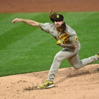 Mike Clevinger pitches for the Padres during the 2022 MLB playoffs. | USA TODAY / VIA REUTERS