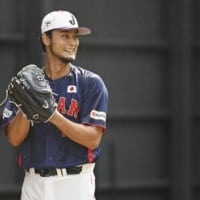 Yu Darvish pitches in the bullpen in Miyazaki on Saturday during Japan's training camp for next month's WBC. | KYODO