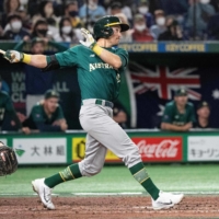 Australia's Logan Wade strokes a hit to drive in two runs in the seventh inning during the World Baseball Classic Pool B game between the Czech Republic and Australia in Tokyo on Monday. | AFP-JIJI