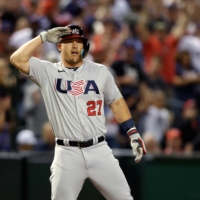 U.S. outfielder Mike Trout celebrates with a salute after hitting a triple in the first inning against Colombia during the World Baseball Classic at Chase Field in Phoenix on Wednesday. | USA TODAY / VIA REUTERS