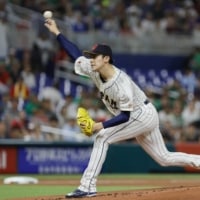Japan starting pitcher Roki Sasaki delivers a pitch during the first inning of their World Baseball Classic semifinal against Mexico at LoanDepot Park in Miami on Monday. | USA TODAY / VIA REUTERS