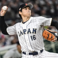 Japan starter Shohei Ohtani pitches against Italy during the quarterfinal round of the World Baseball Classic at Tokyo Dome on Thursday. | AFP-JIJI