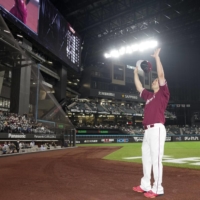 Eagles' Masahiro Tanaka waves to fans at Es Con Field Hokkaido in Kitahiroshima, Hokkaido, on Thursday. | KYODO