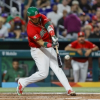 Mexico third baseman Isaac Paredes hits a home run during the third inning against Puerto Rico during the World Baseball Classic at LoanDepot Park in Miami on Friday. | USA TODAY / VIA REUTERS
