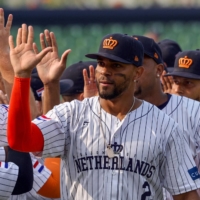 Netherlands' Xander Bogaerts celebrates with teammates after victory during the World Baseball Classic game against Cuba at Taichung Intercontinental Baseball Stadium in Taiwan on Wednesday. | AFP-JIJI