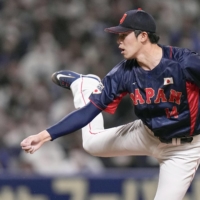 Samurai Japan's Roki Sasaki through a ball that hit 165 kilometers per hour, matching Shohei Ohtani's mark for the fastest pitch thrown by a Japanese pitcher, during a WBC warm up game against the Chunichi Dragons on Saturday. | KYODO