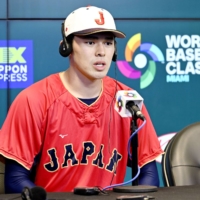 Roki Sasaki speaks during a news conference ahead of Japan's WBC semifinal in Miami. | KYODO
