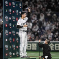 Ohtani gestures to the crowd during a post-game interview after a World Baseball Classic game against China at Tokyo Dome on Thursday. | AFP-JIJI