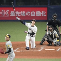 Japan's Shohei Ohtani connects on a three-run home run during the third inning against the Tigers at Kyocera Dome Osaka on Monday. | KYODO