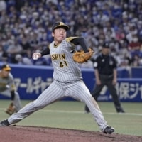 Hanshin Tigers rookie Shoki Murakami pitches against the Chunichi Dragons in Nagoya on Saturday. | KYODO