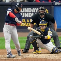 Red Sox outfielder Masataka Yoshida hits a grand slam against the Brewers in Milwaukee on Sunday. Boston won 12-5. | USA TODAY / VIA REUTERS