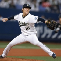 Orix's Yoshinobu Yamamoto pitches against the Marines in Osaka on Saturday. | KYODO
