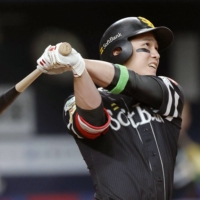 SoftBank's Ryoya Kurihara hits a two-run home run against the Buffaloes in Osaka on Tuesday. | KYODO
